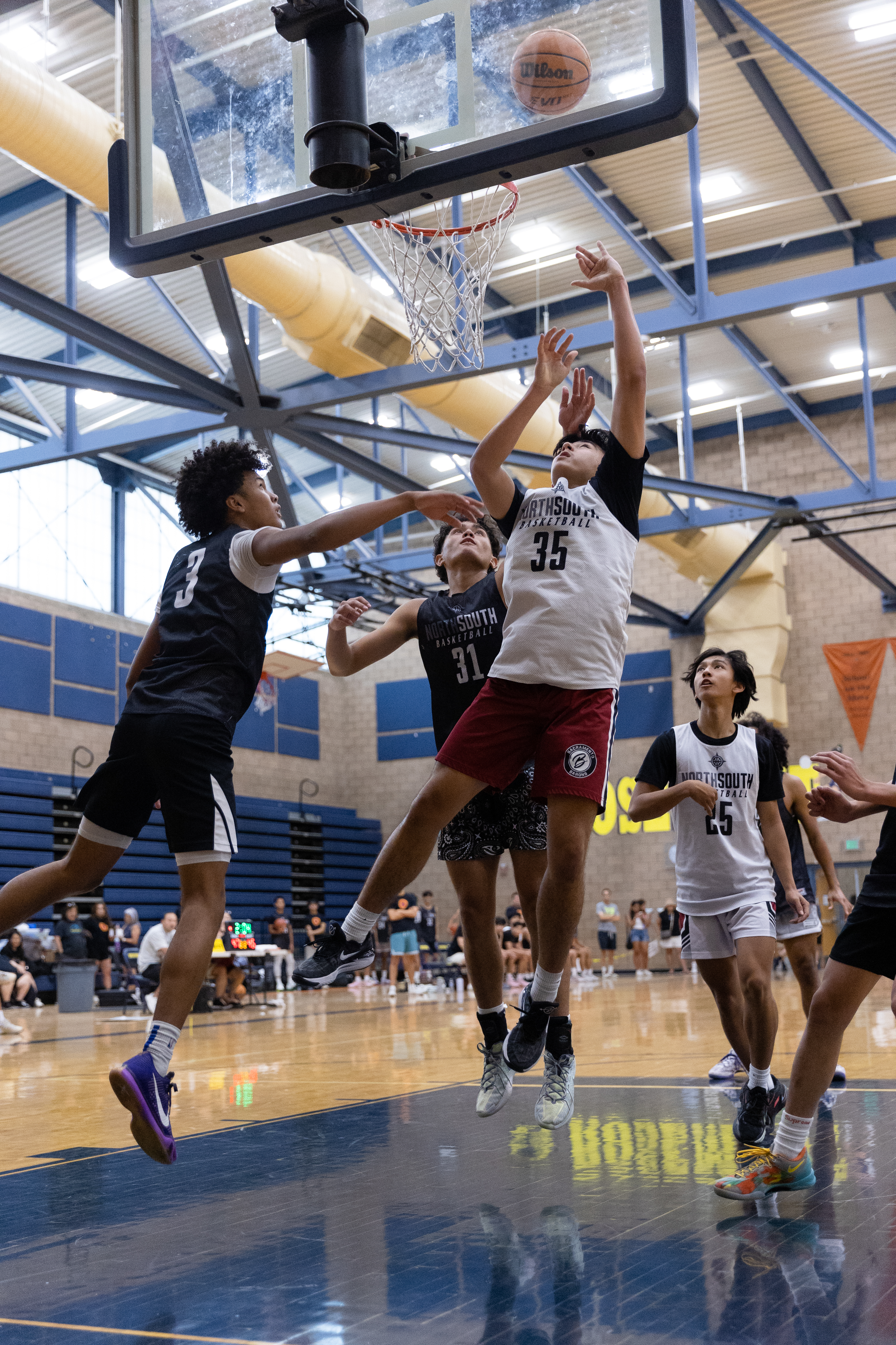 Basketball game action layup