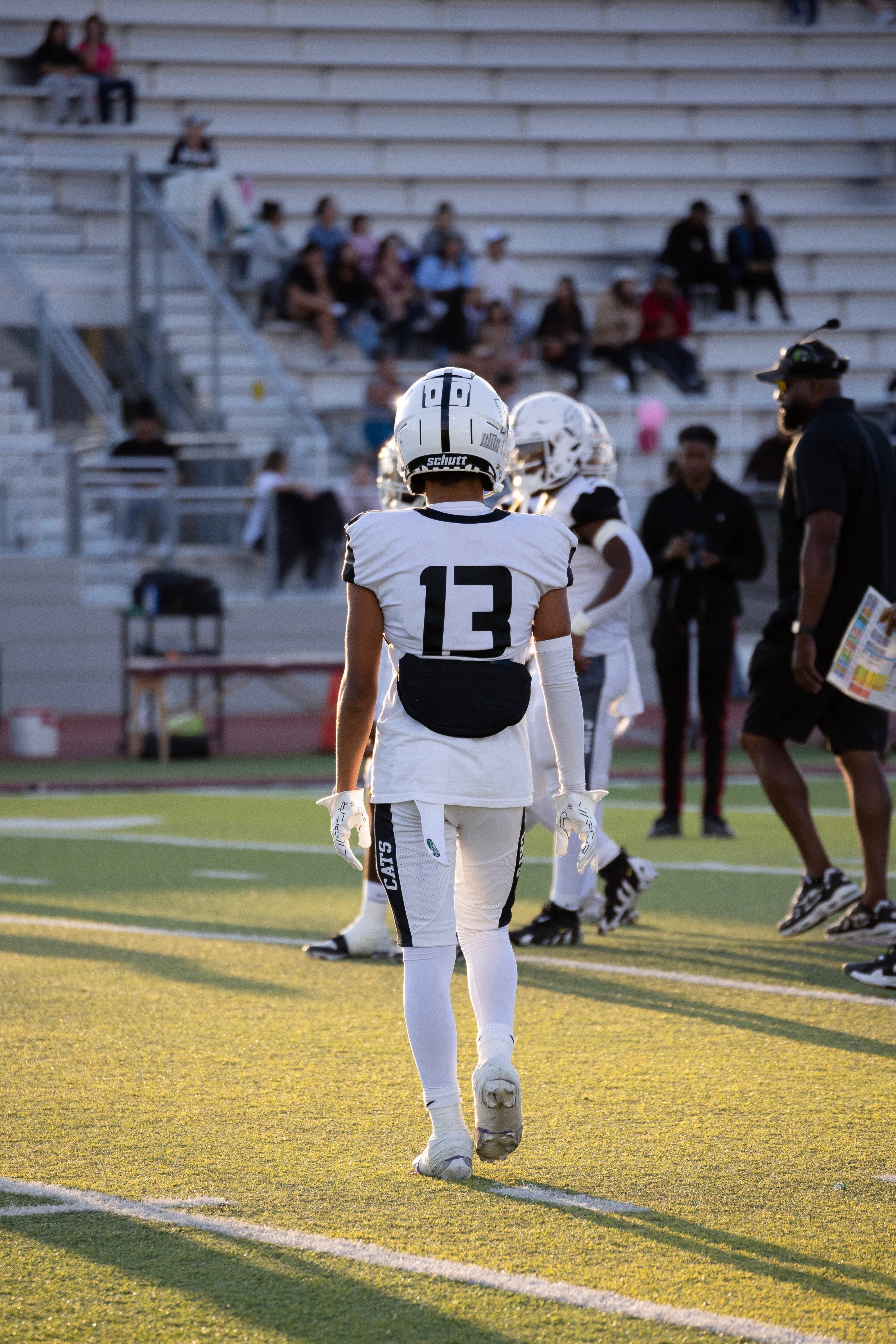 Football player walking on field