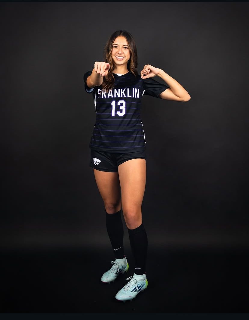 Soccer player dark background portrait